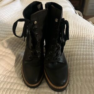 Brand new heeled boots. Has zipper on inside. In excellent shape only worn once